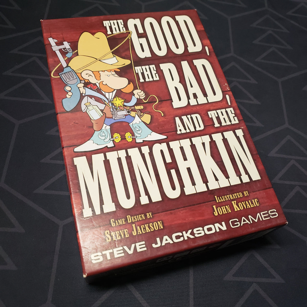 Image shows the front cover of the box of the Good, the Bad, and the Munchkin card game