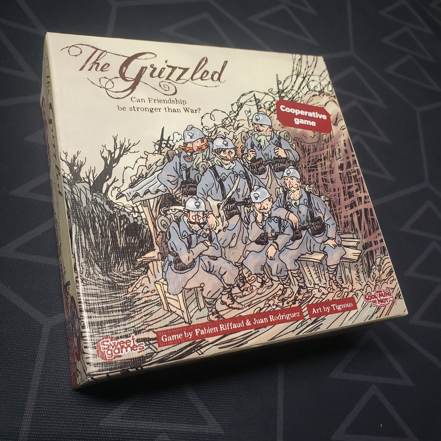 Image shows the front cover of the box of the Grizzled card game