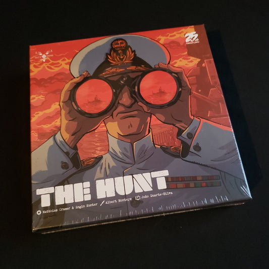 Image shows the front cover of the box of the board game The Hunt