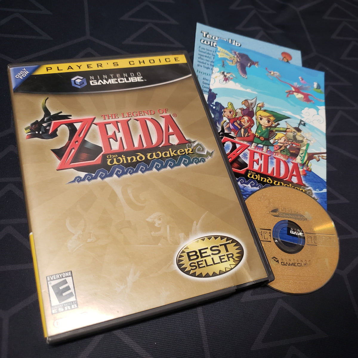 Image shows the case, manual and disc for the video game The Legend of Zelda: The Wind Waker for Nintendo GameCube