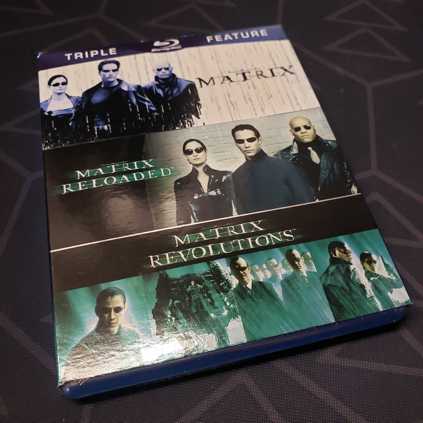 Image shows the front of the case for the movie set of The Matrix Trilogy on Blu-Ray