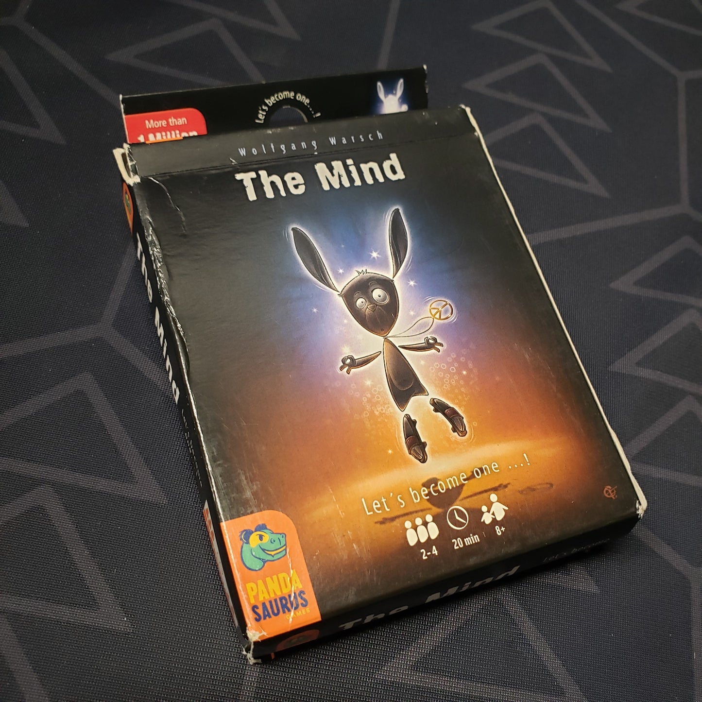 Image shows the front cover of the box of the Mind card game