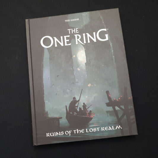 Image shows the front cover of the Ruins of the Lost Realm book for the One Ring roleplaying game