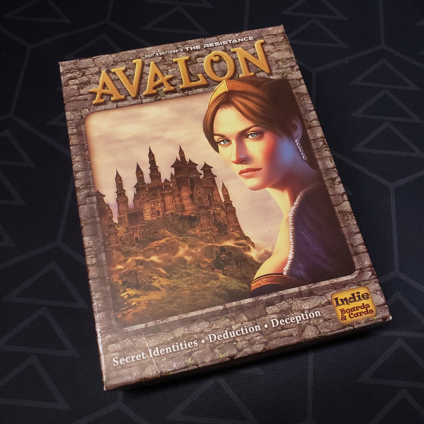 Image shows the front cover of the box for The Resistance: Avalon card game