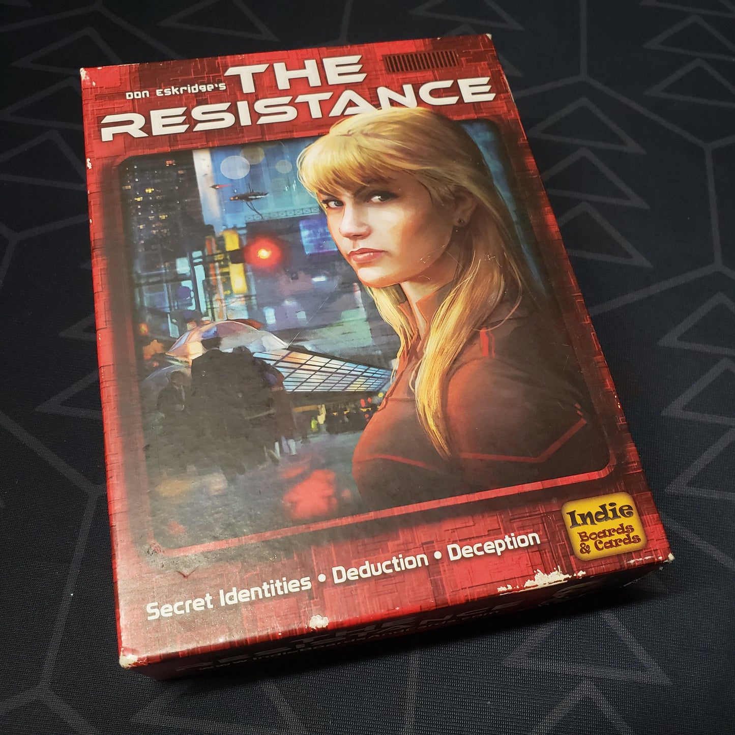 Image shows the front cover of the box of the Resistance card game