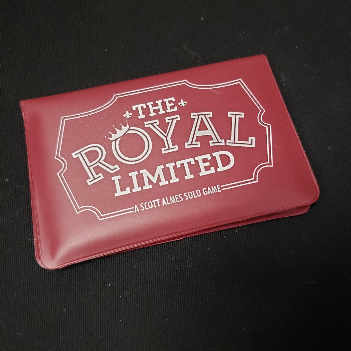 Image shows the front cover of the card wallet of the Royal Limited solo card game