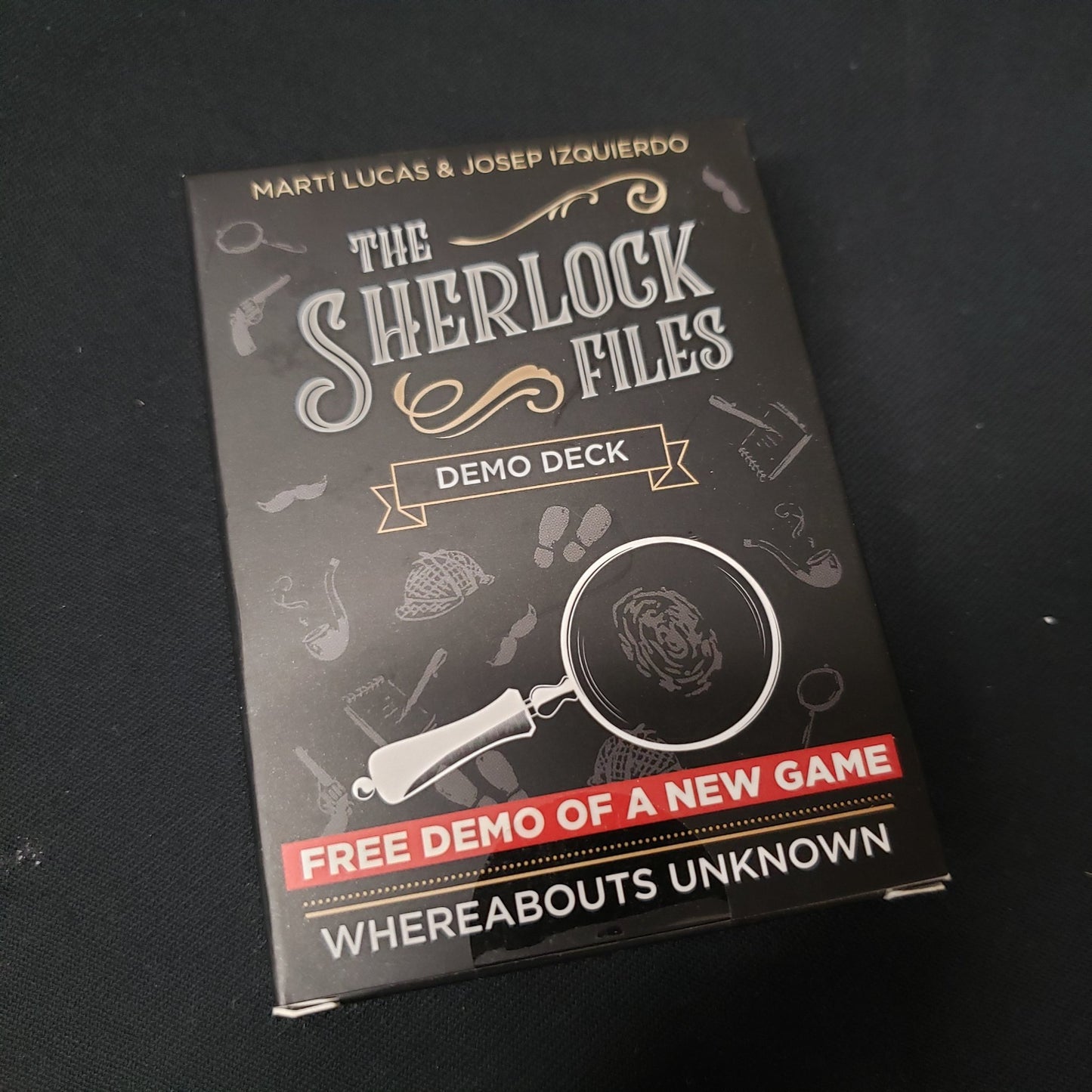 Image shows the front cover of the box of the Demo Deck for the mystery card game The Sherlock Files