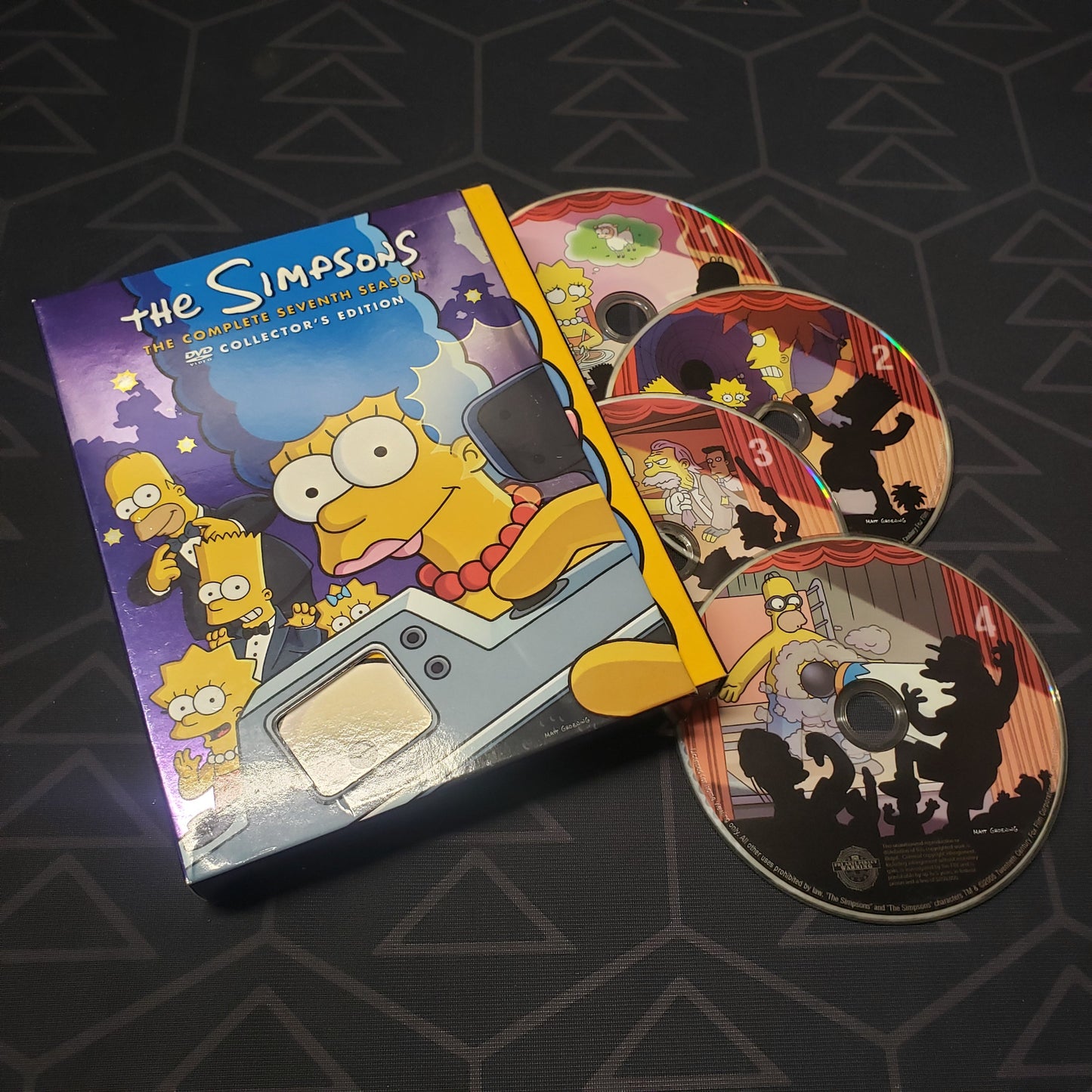 Image shows the case & four discs for the seventh season of The Simpsons on DVD