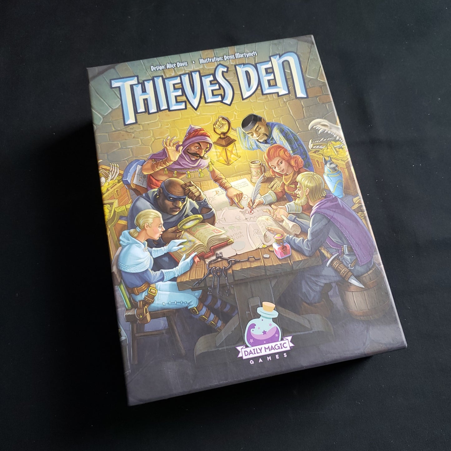 Image shows the front cover of the box of the Thieves Den board game