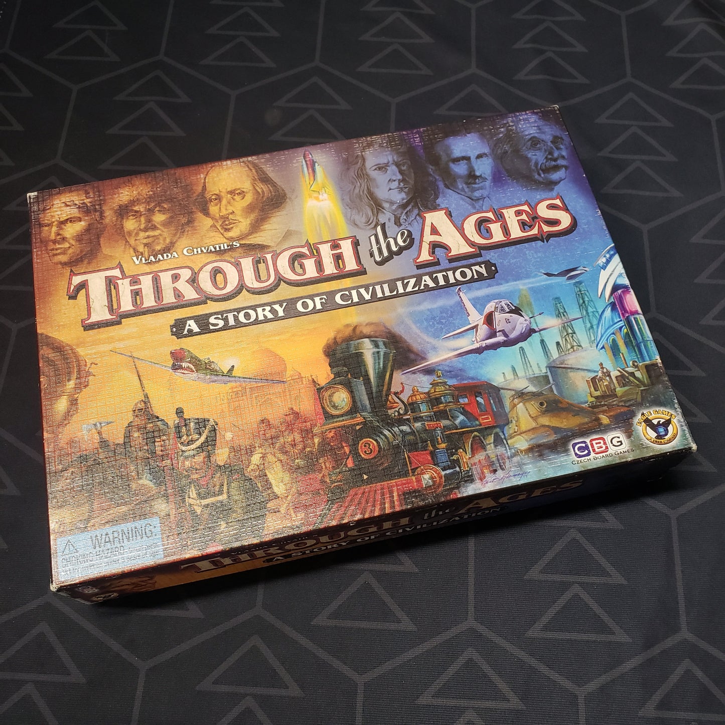 Image shows the front cover of the box of the Through the Ages board game