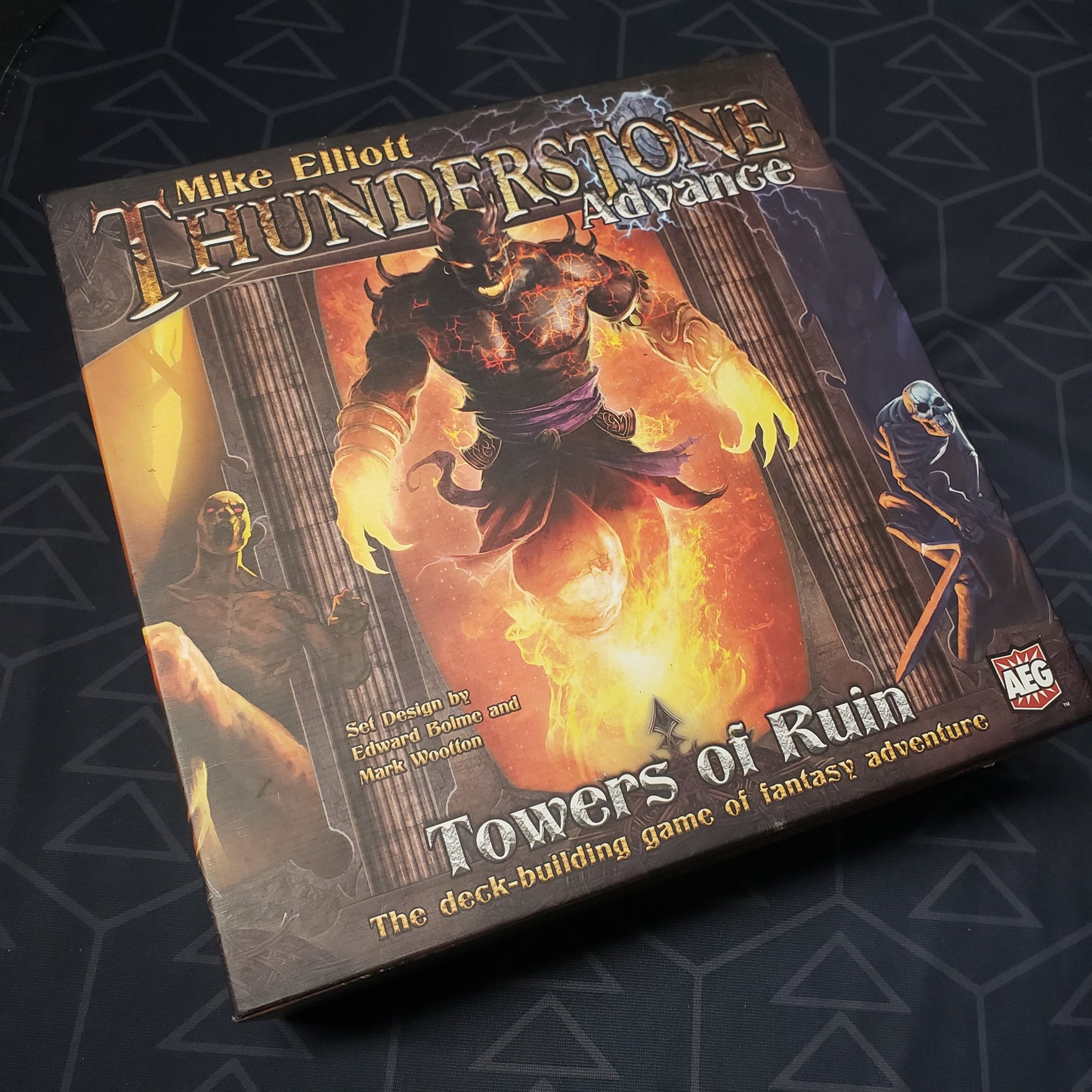 Image shows the front cover of the box of the Thunderstone Advance: Towers of Ruin board game