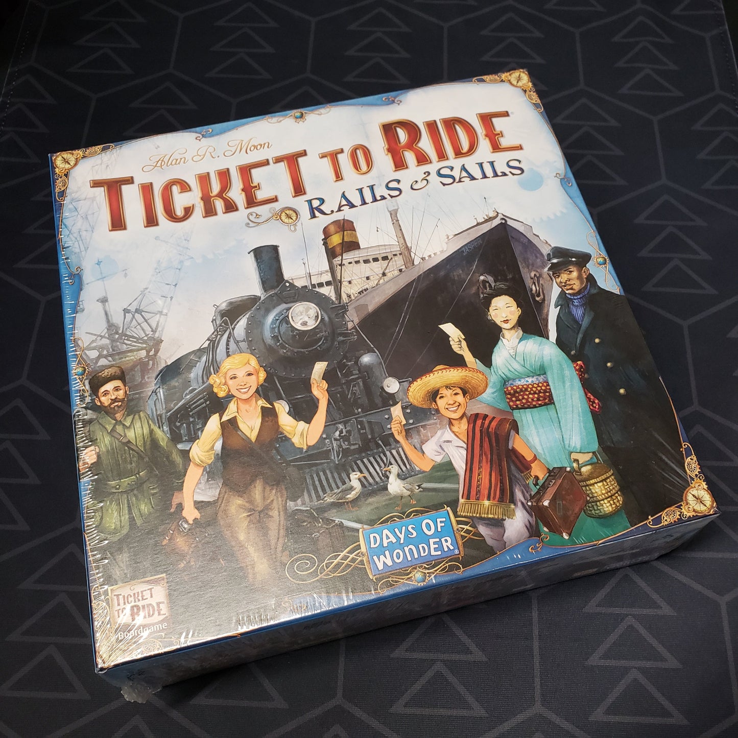 Image shows the front cover of the box of the Ticket to Ride: Rails and Sails board game