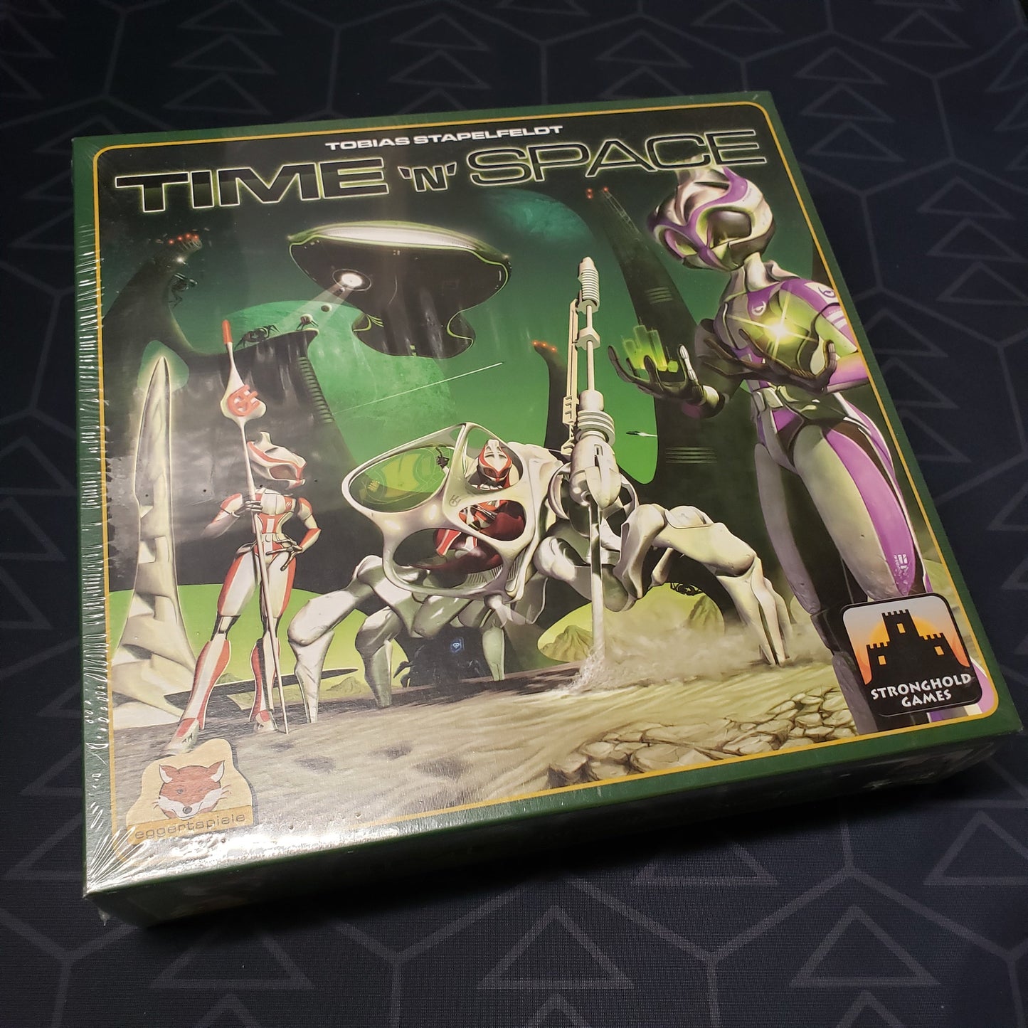Image shows the front cover of the box for the Time N Space board game