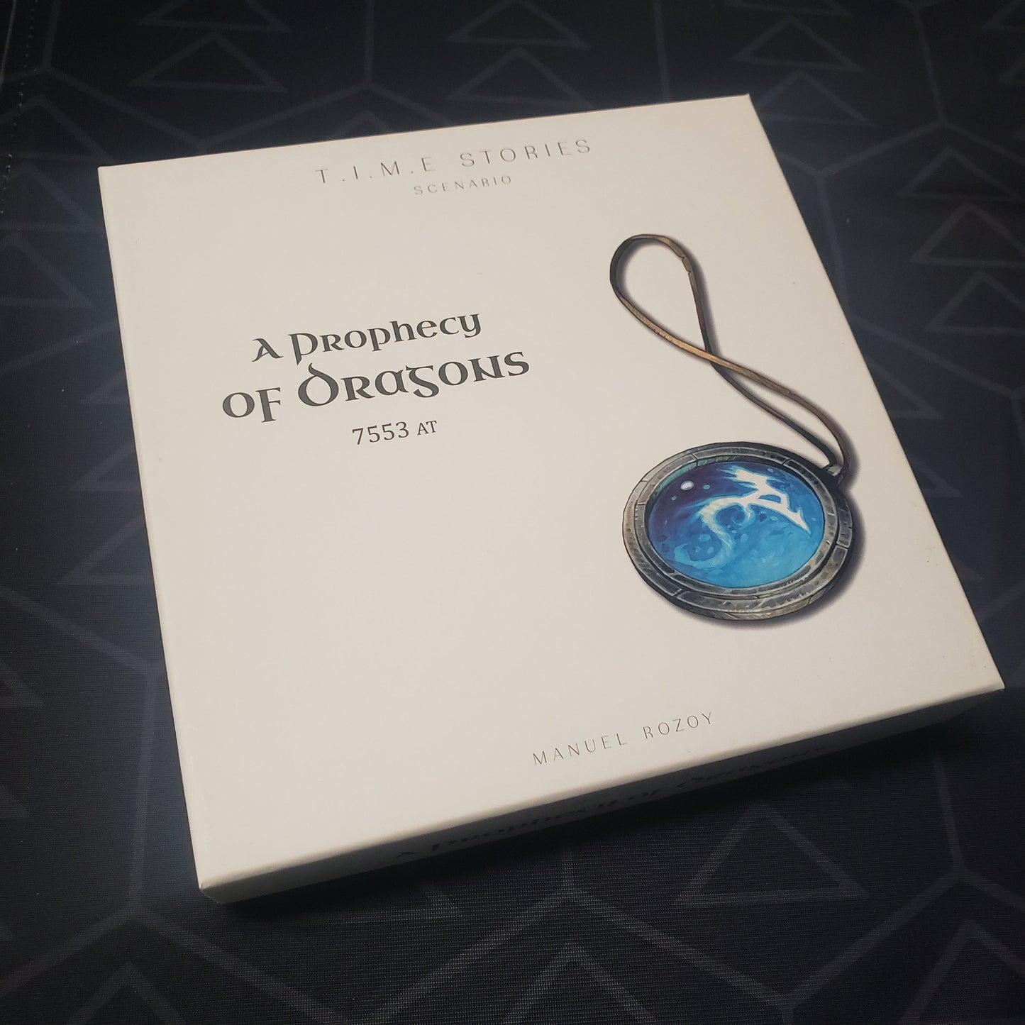 Image shows the front cover of the box of the Prophecy of Dragons expansion for the TIME Stories board game