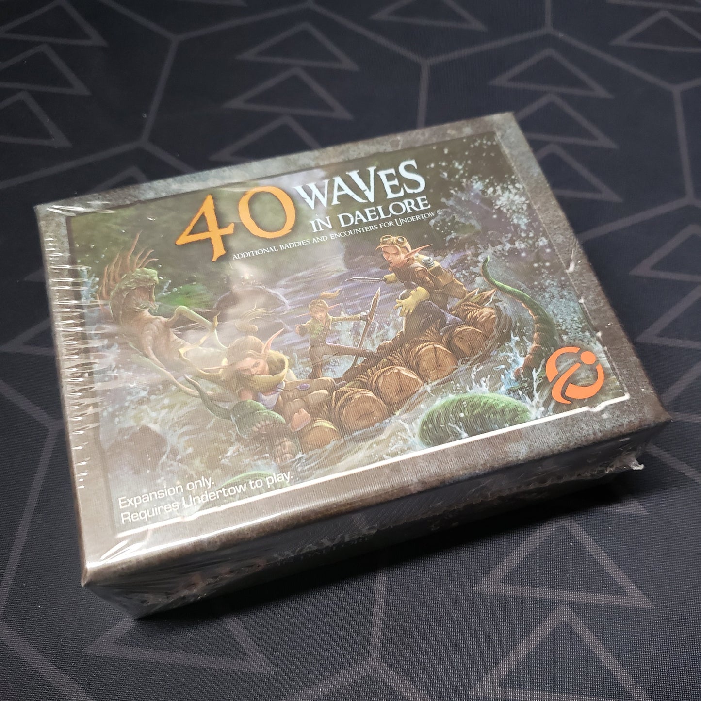 Image shows the front of the box for the 40 Waves in Daelore expansion for the board game Too Many Bones