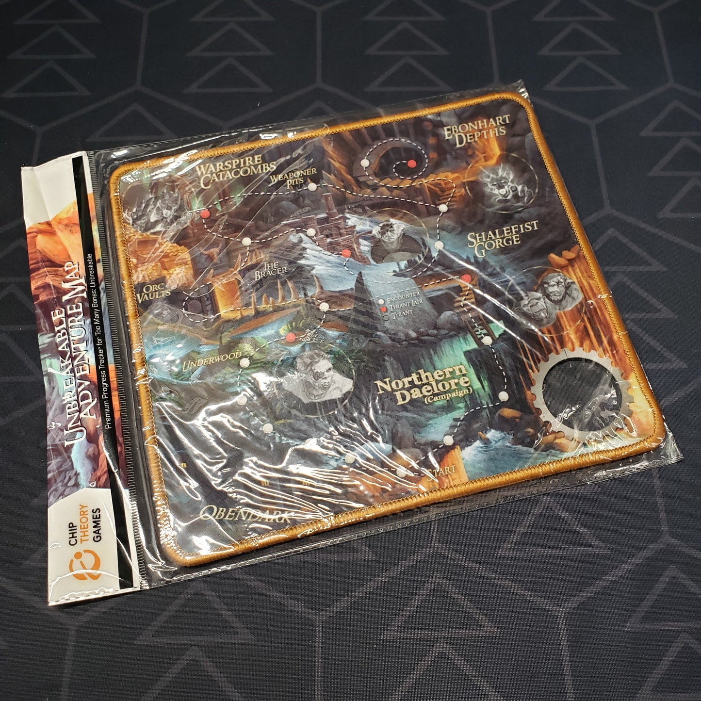 Image shows the neoprene "The Break" Adventure Map for the board game Too Many Bones in plastic packaging