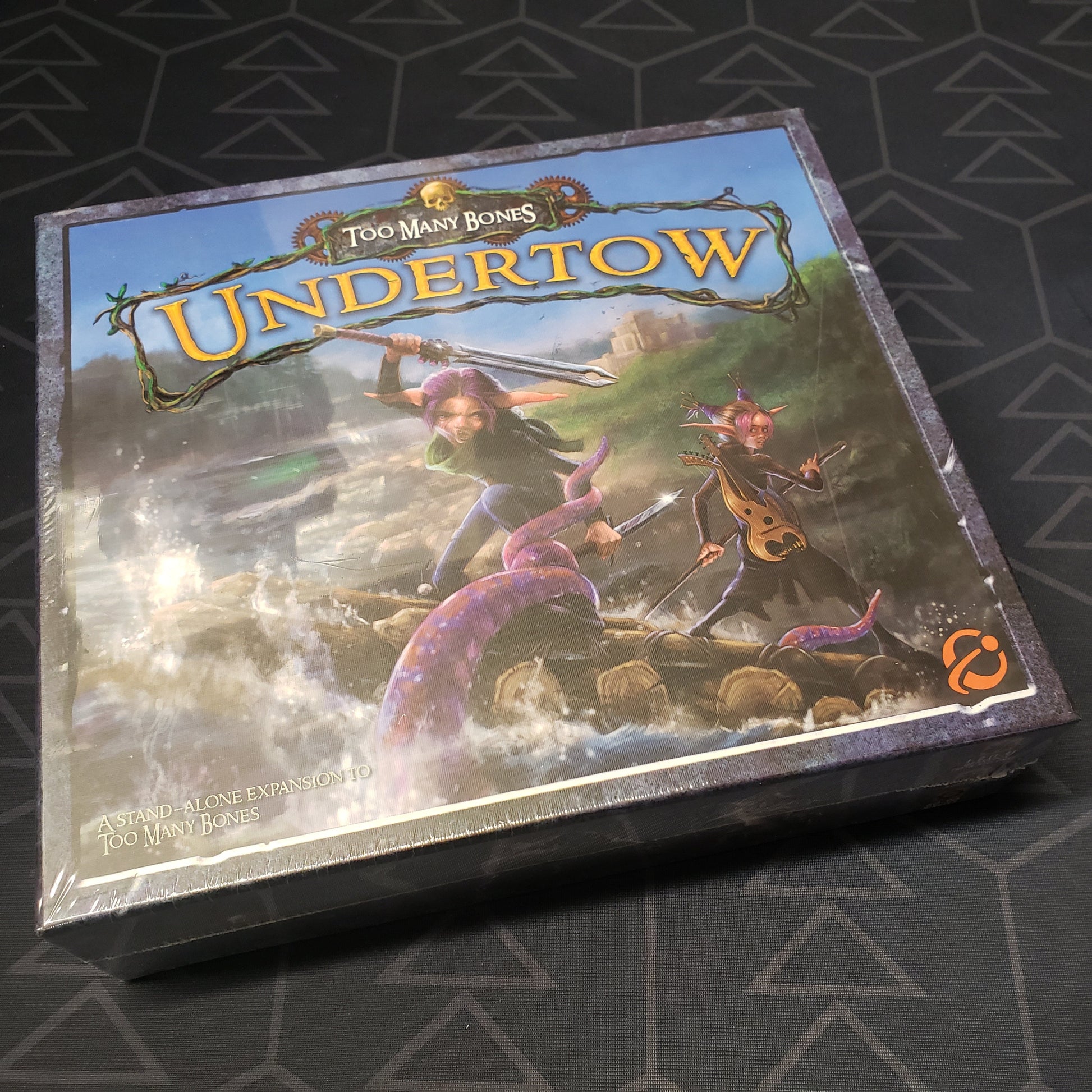 Image shows the front cover of the box of the Too Many Bones: Undertow board game