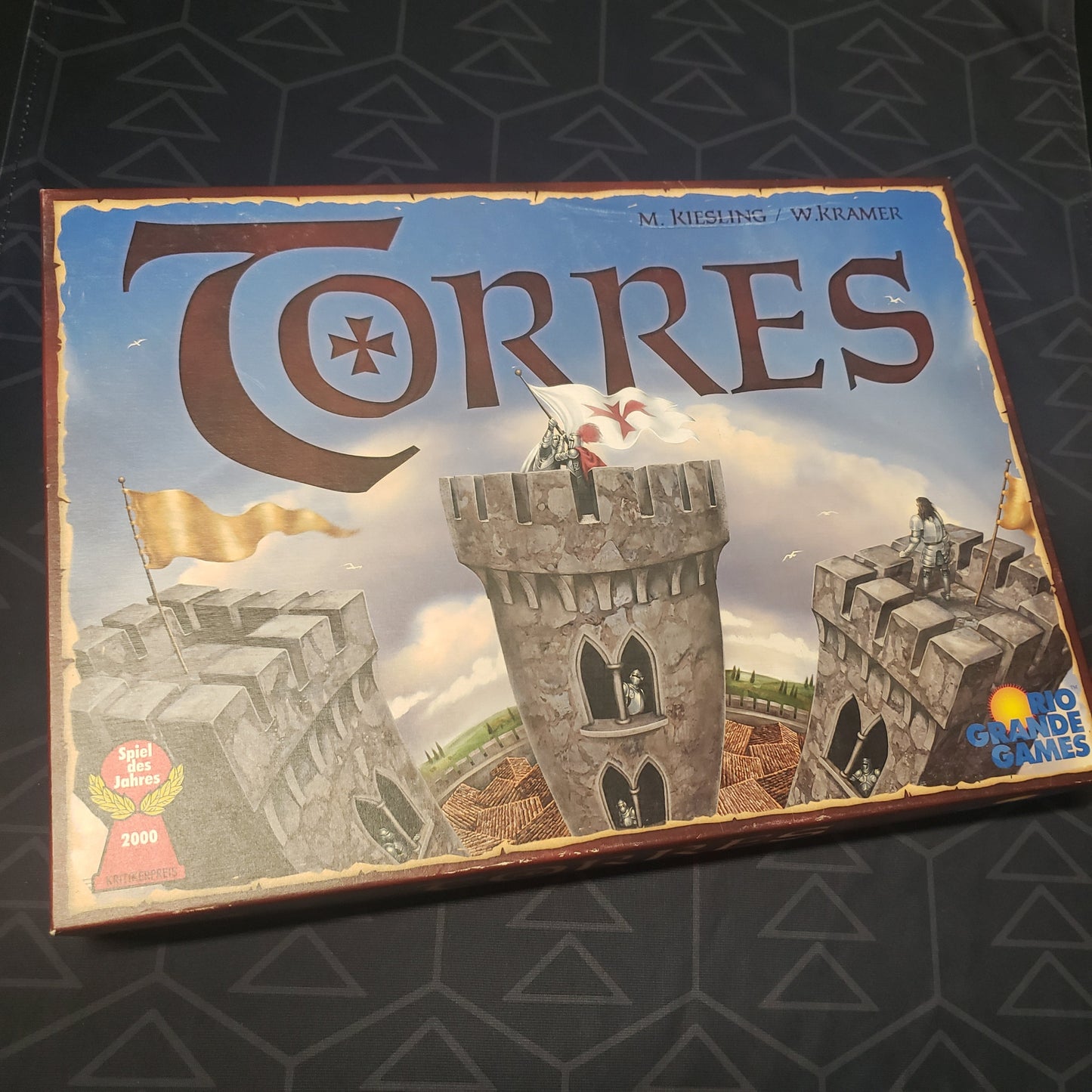 Image shows the front cover of the box for the Torres (Third Edition) board game