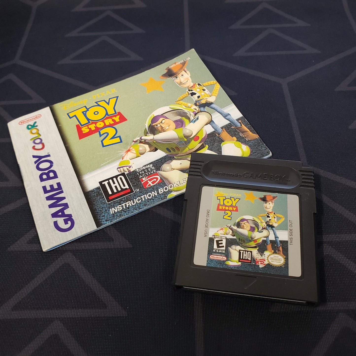 Image shows the manual & cartridge for the video game Toy Story 2 for Nintendo Game Boy Color