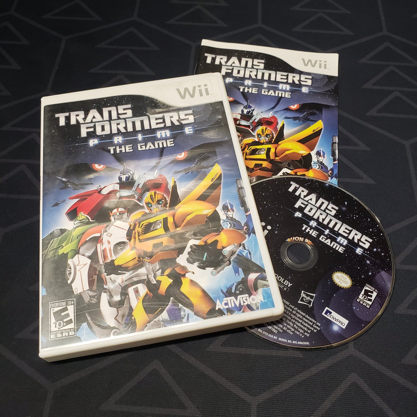 Image shows the case, manual and disc for the video game Transformers Prime: The Game for Nintendo Wii