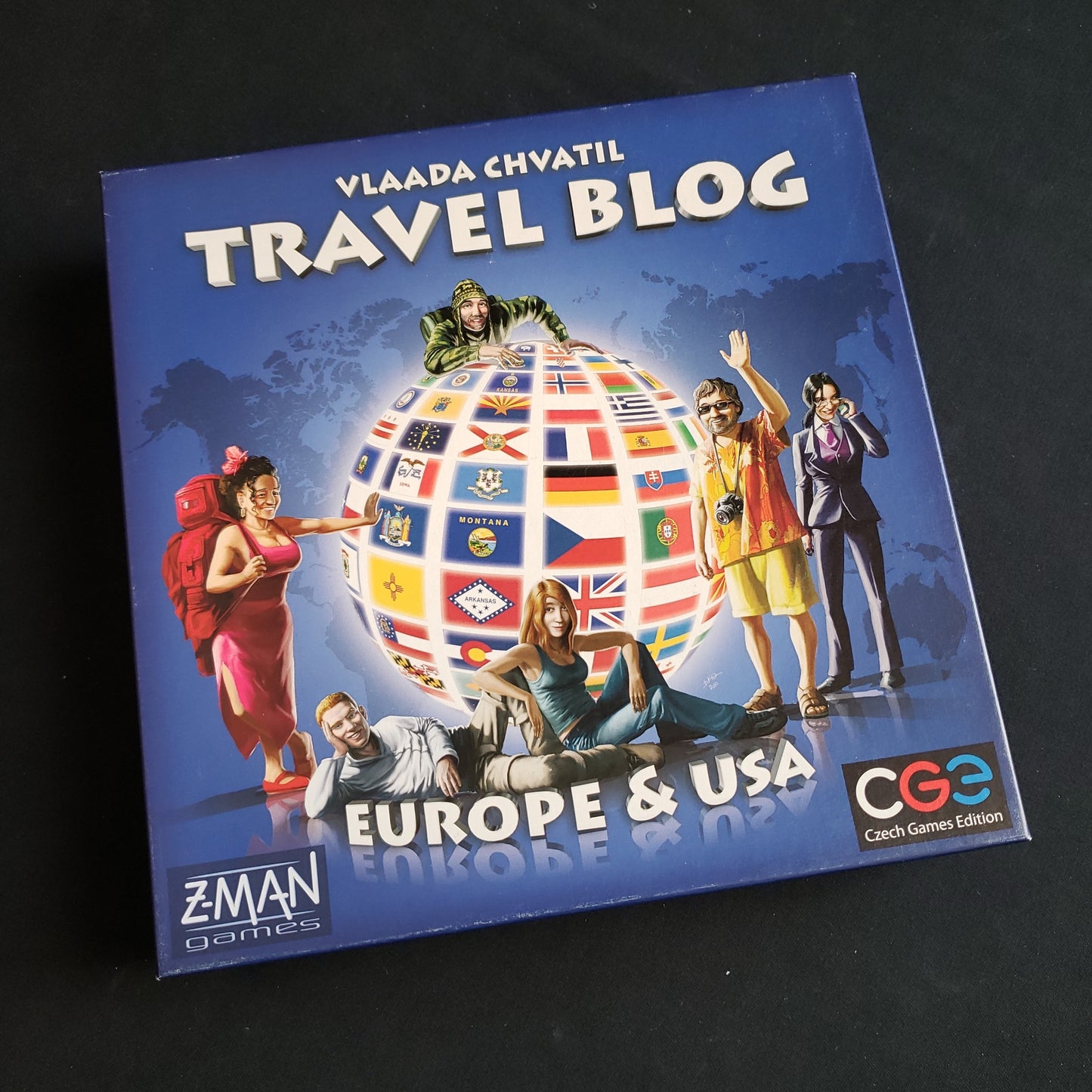 Image shows the front cover of the box of the Travel Blog board game