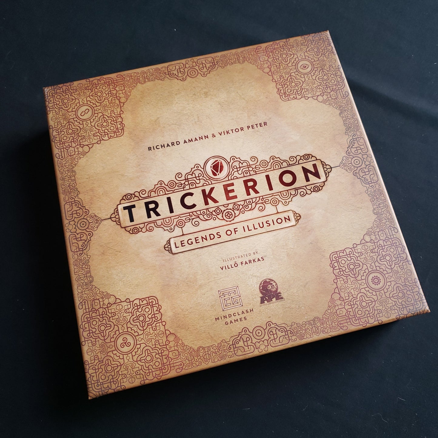 Image shows the front cover of the box of the Trickerion: Legends of Illusion board game
