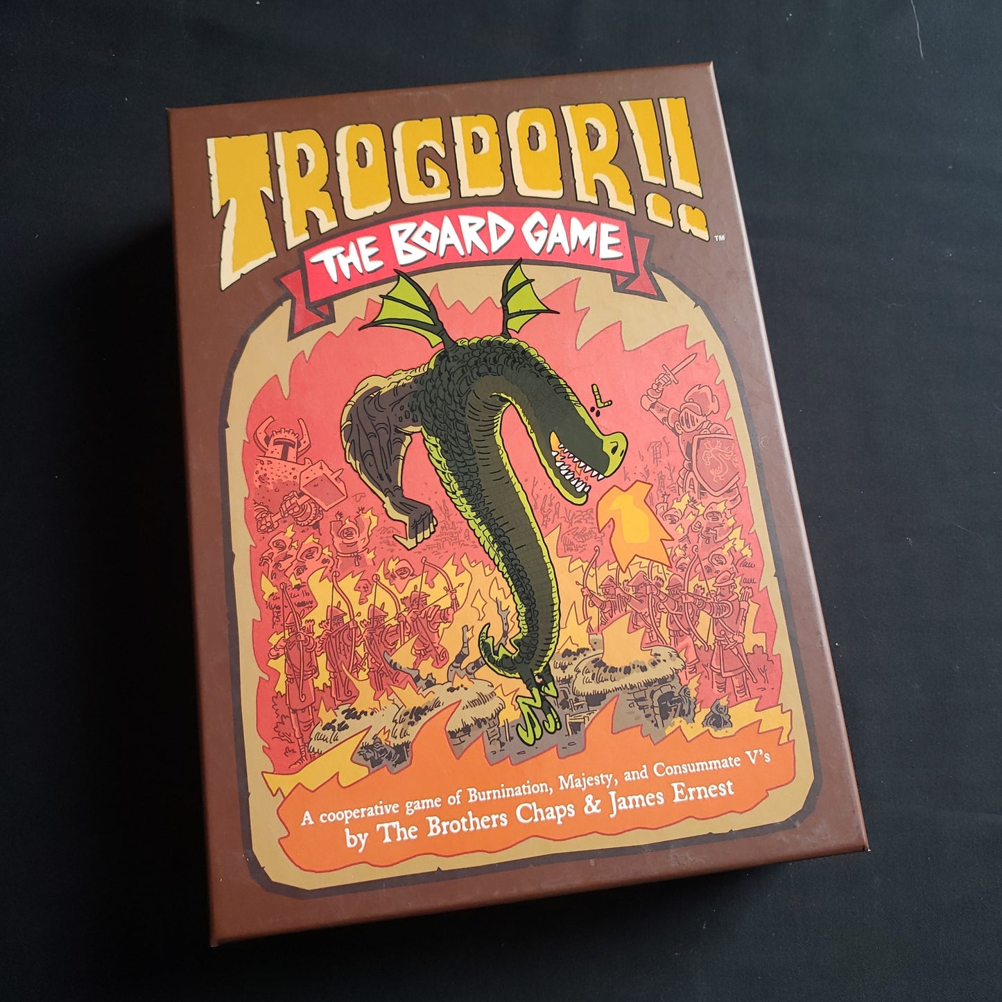 Image shows the front cover of the box of Trogdor: The Board Game