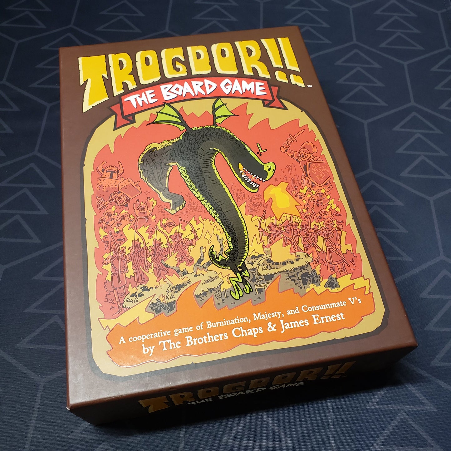 Image shows the front cover of the box of Trogdor: The Board Game