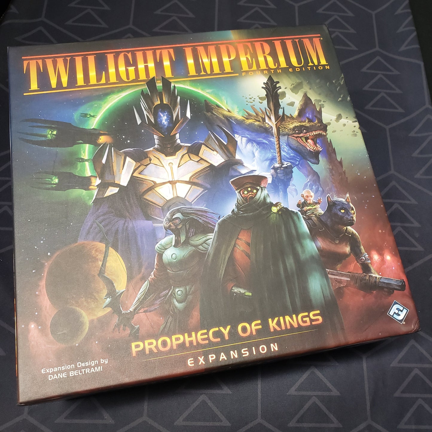 Image shows the front cover of the box of the Prophecy of Kings expansion for the board game Twilight Imperium