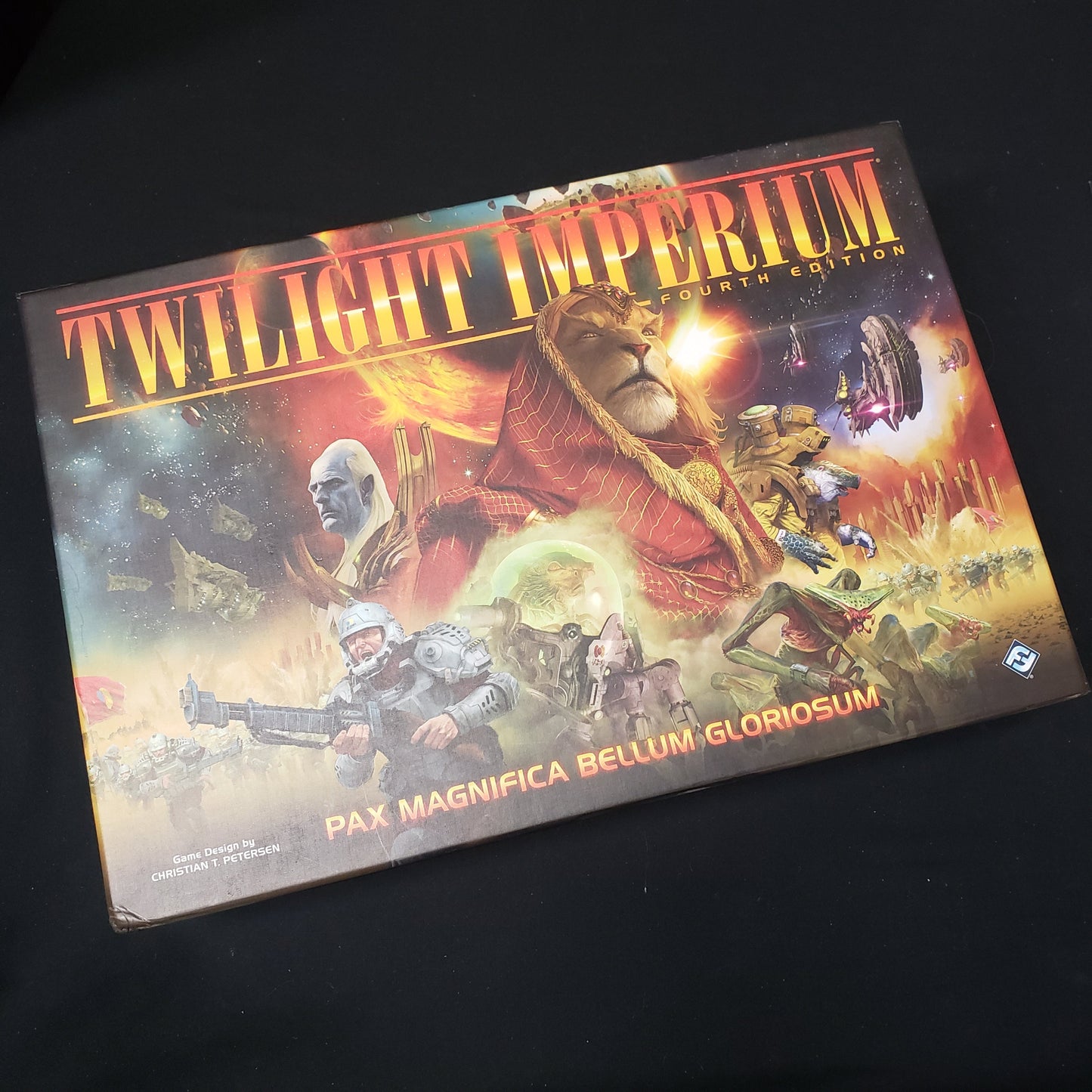 Image shows the front cover of the box of the board game Twilight Imperium (Fourth Edition)