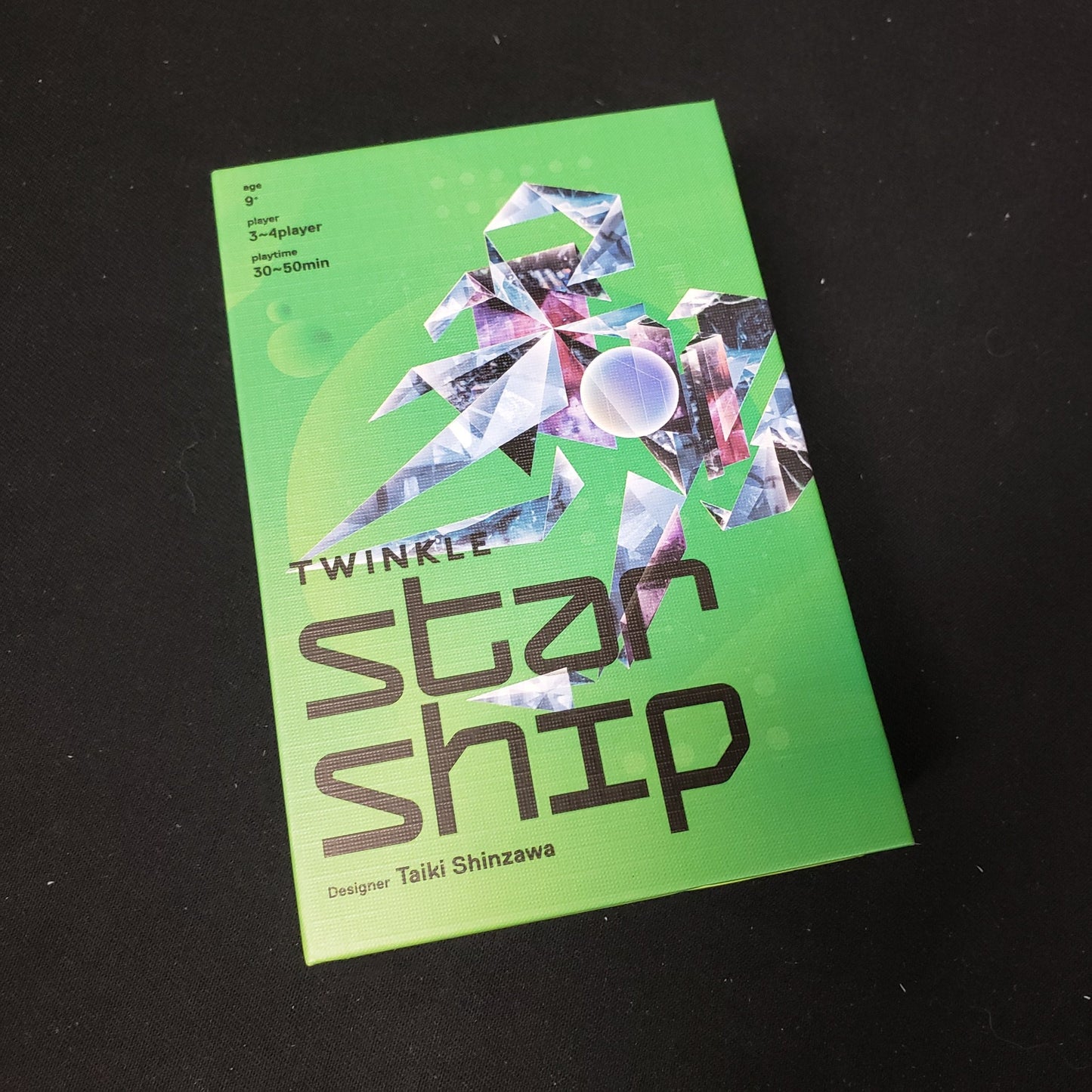 Image shows the front cover of the box of the card game Twinkle Starship