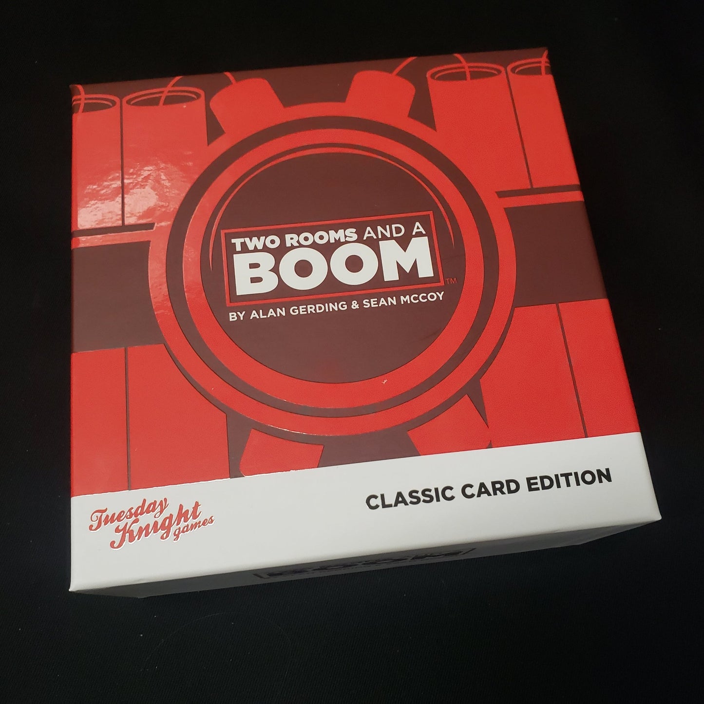 Image shows the front cover of the box of the Two Rooms and a Boom card game