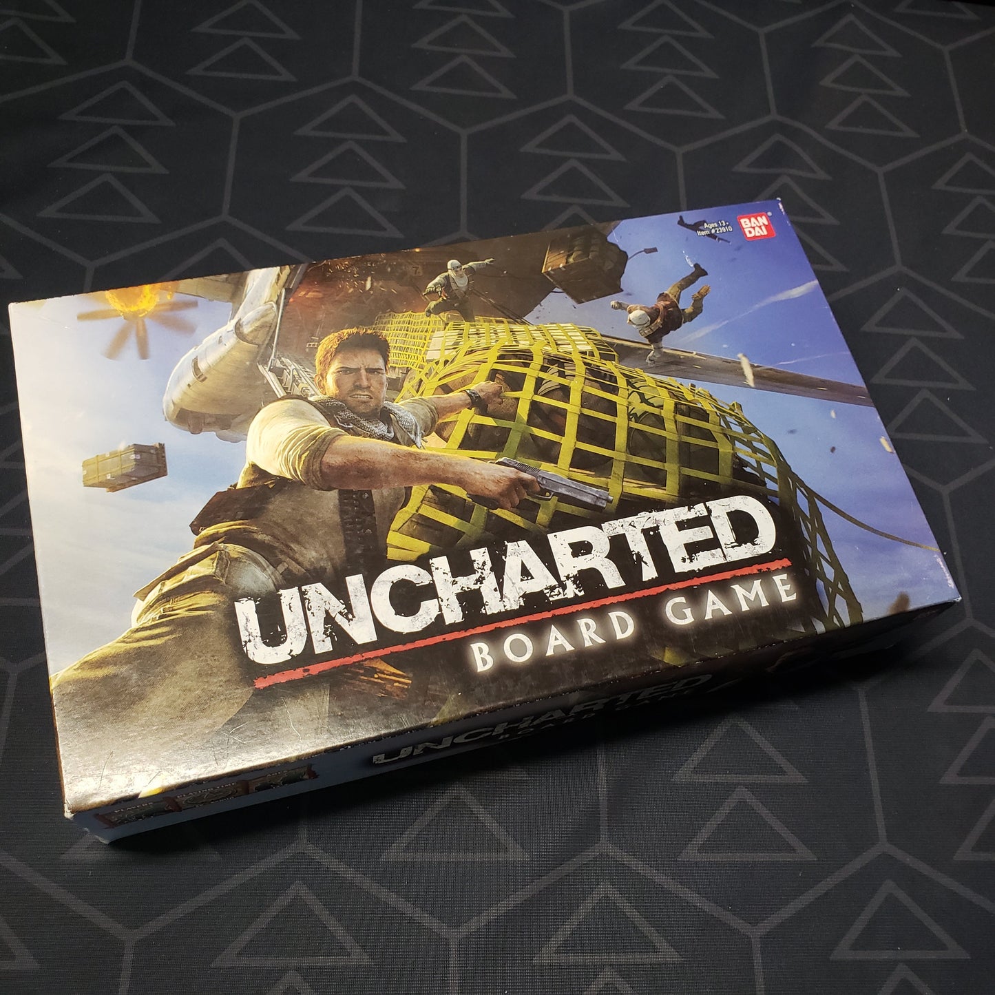 Image shows the front cover of the box of Uncharted: The Board Game
