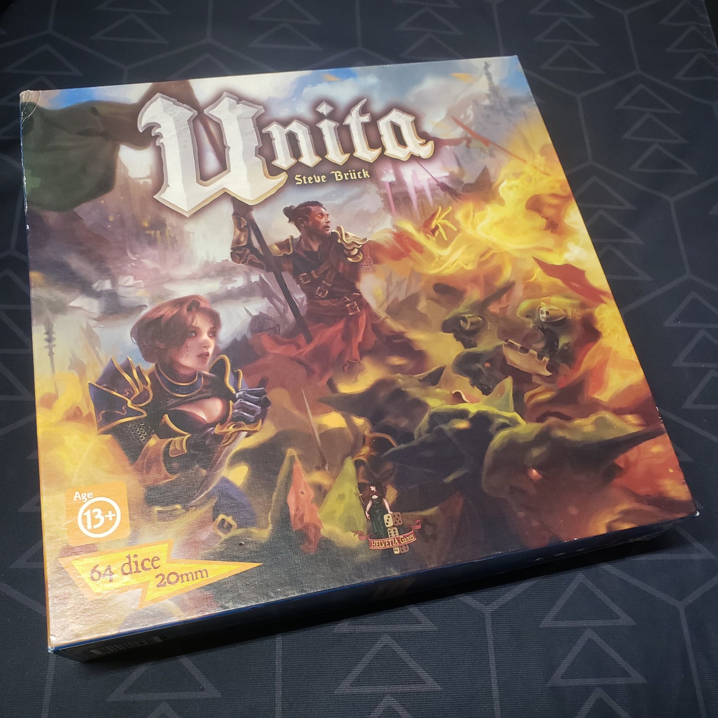 Image shows the front cover of the box of the Unita board game