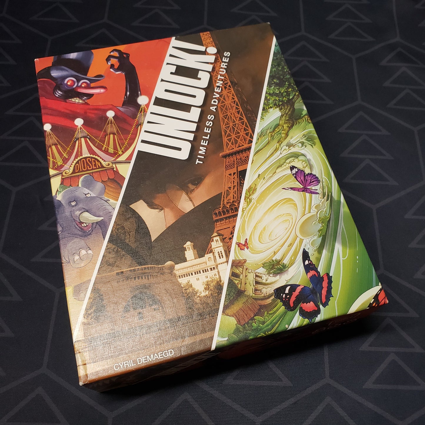Image shows the front cover of the box of the Unlock!: Timeless Adventures card game