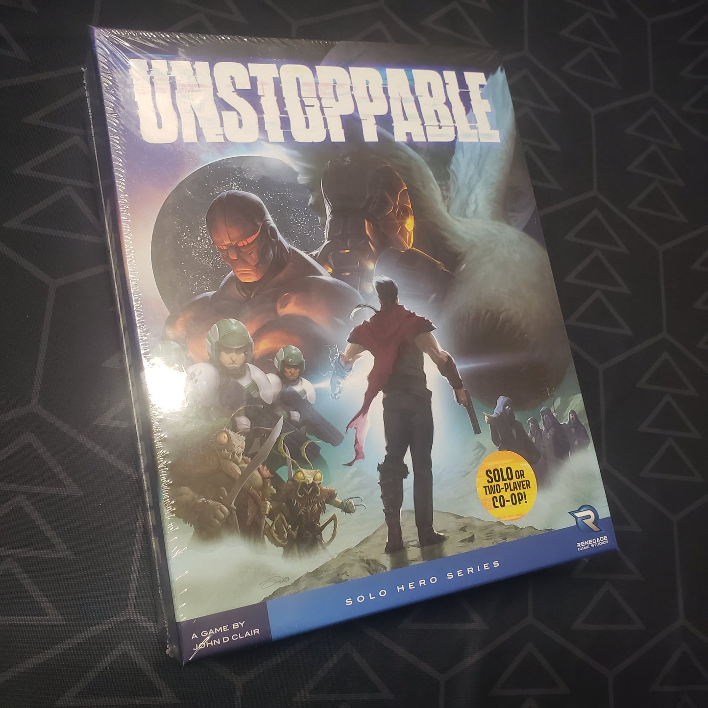 Image shows the front cover of the box for the Unstoppable board game