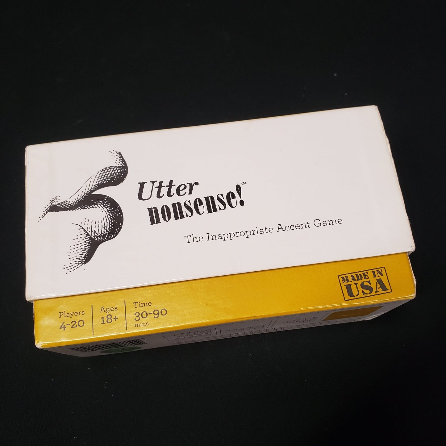 Image shows the front cover of the box of the card game Utter Nonsense