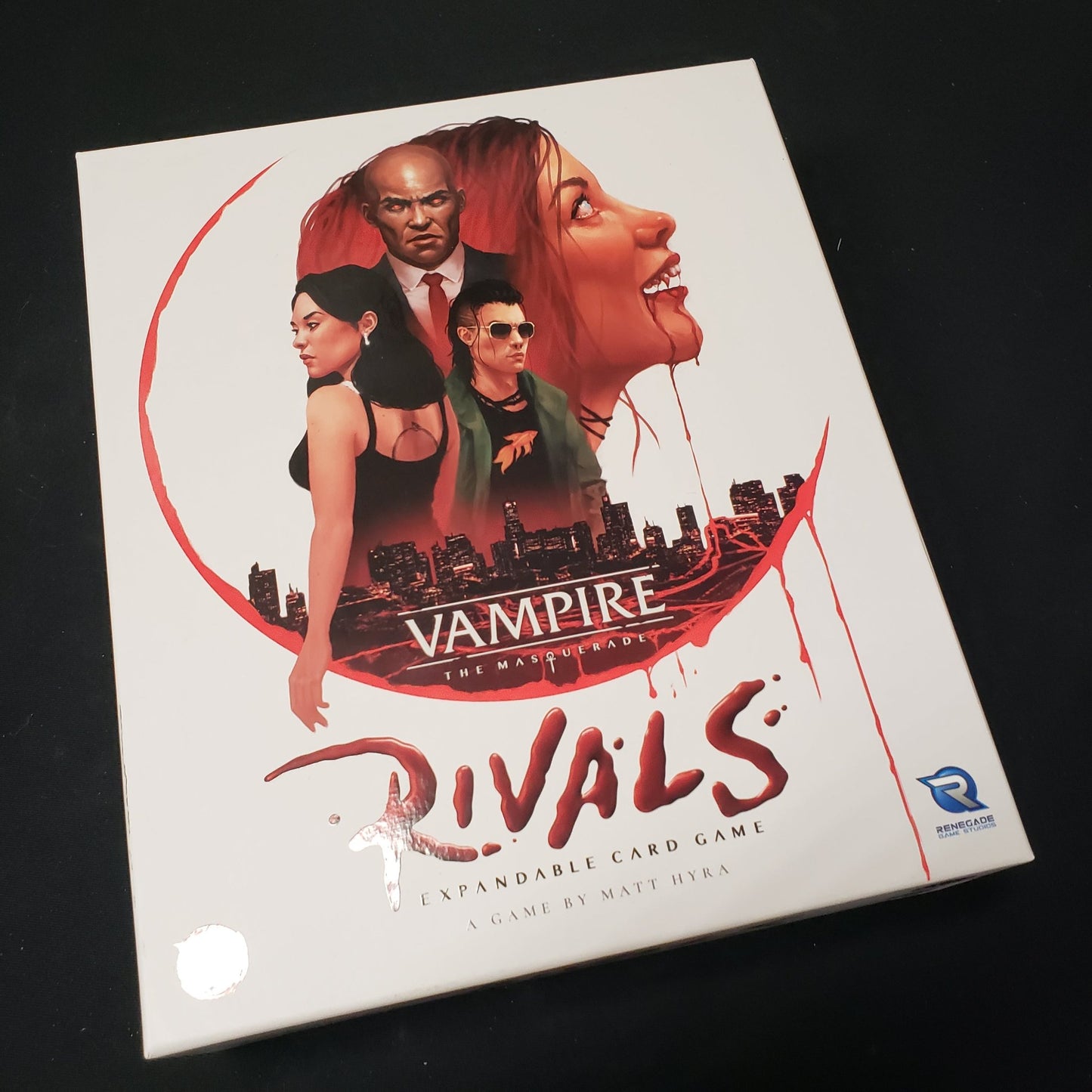 Image shows the front cover of the box of the core set for the card game Vampire The Masquerade: Rivals