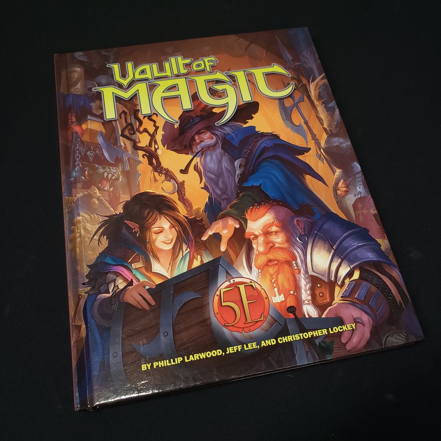 Image shows the front cover of the Vault of Magic 5E roleplaying game book