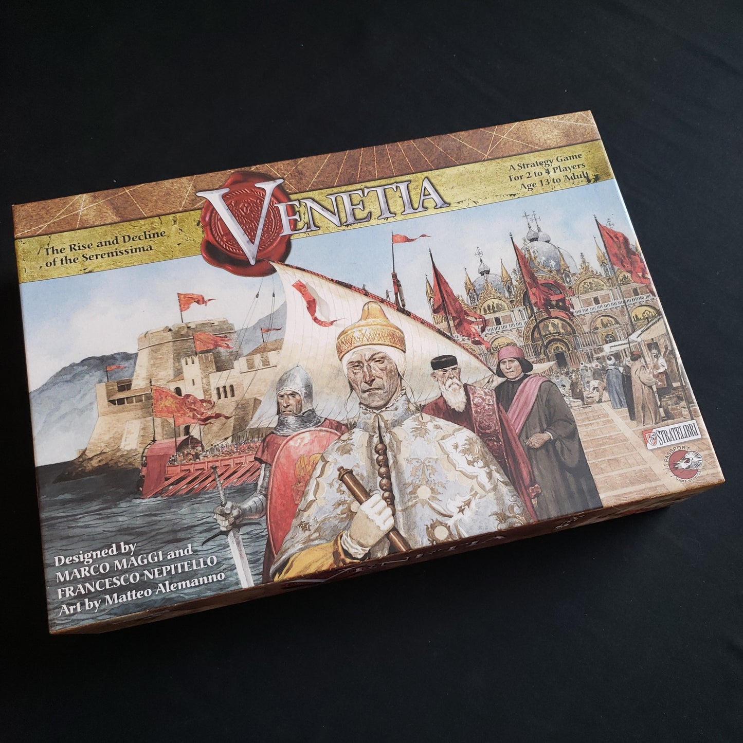 Image shows the front cover of the box of the Venetia board game