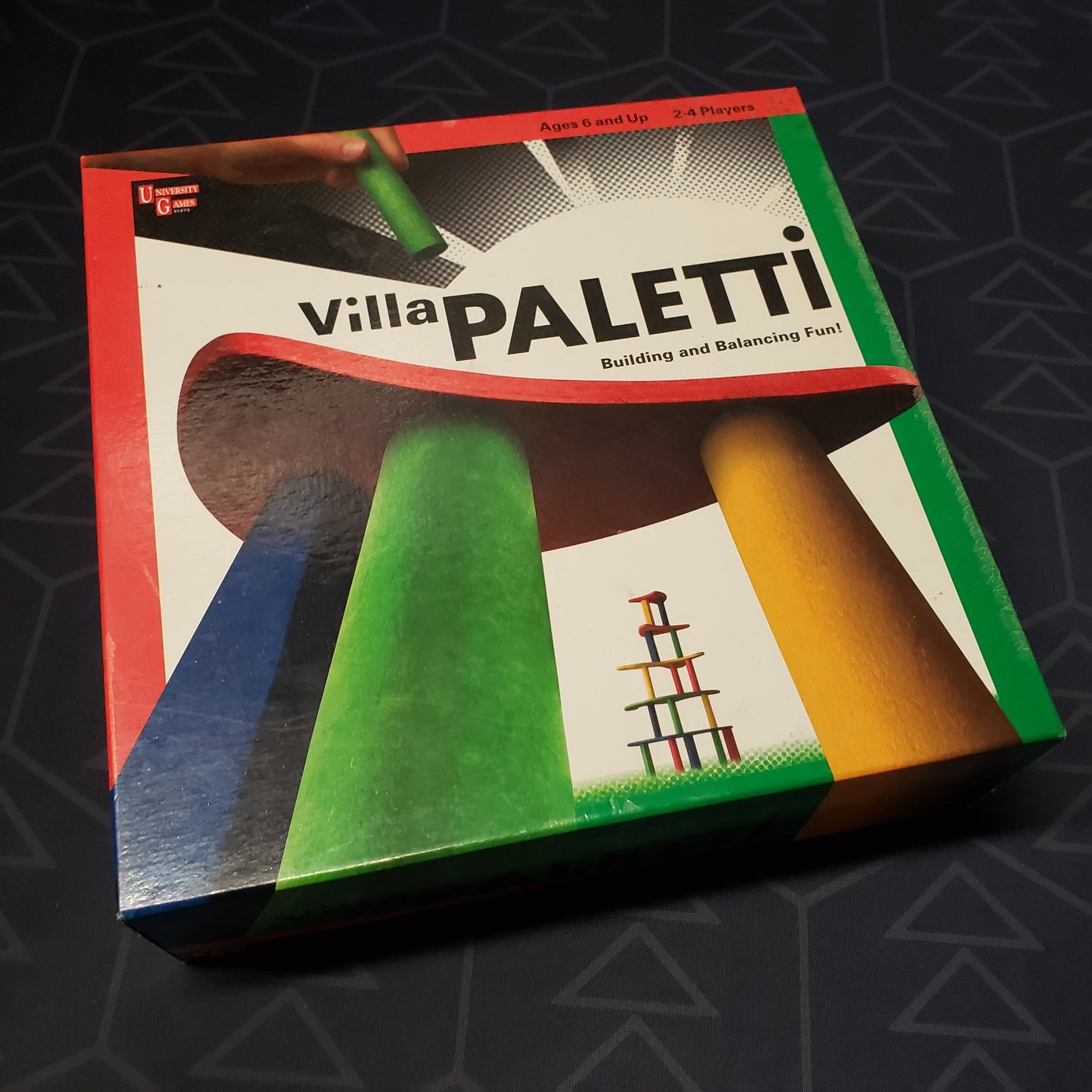 Image shows the front cover of the box for the Villa Paletti board game