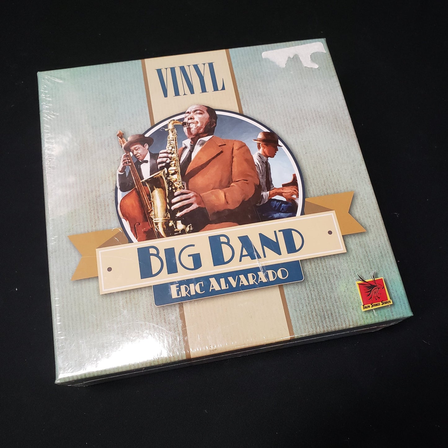 Image shows the front cover of the box of the Vinyl: Big band board game
