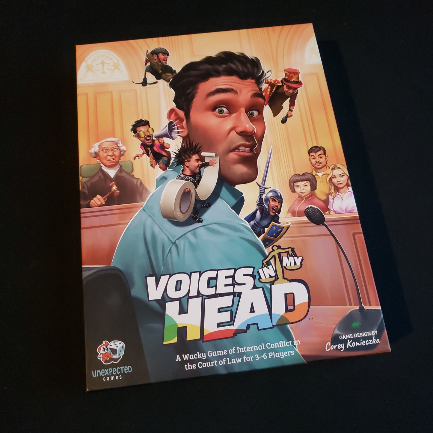 Image shows the front cover of the box of the Voices in My Head board game