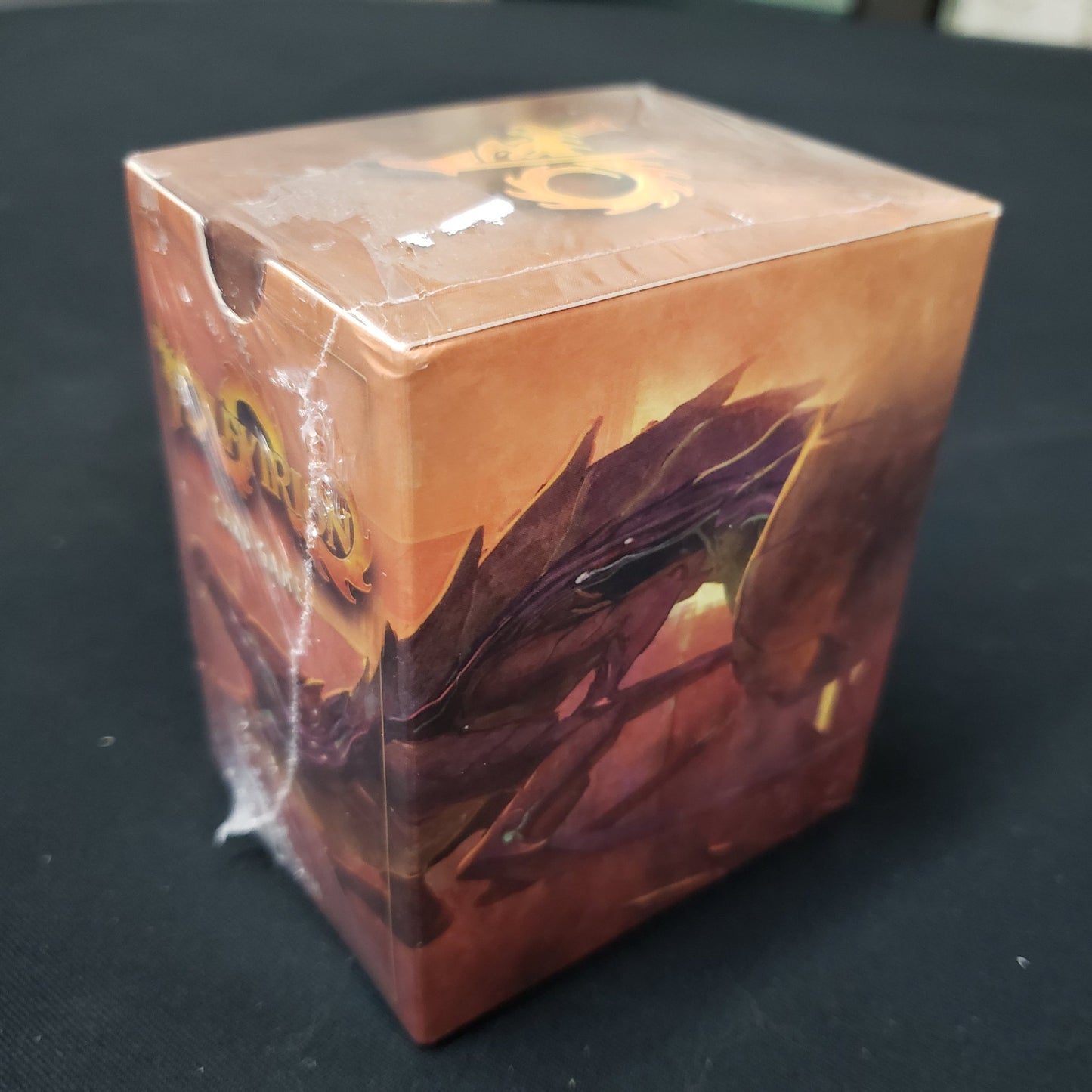 Image shows the front cover of the box of the Volfyirion card game