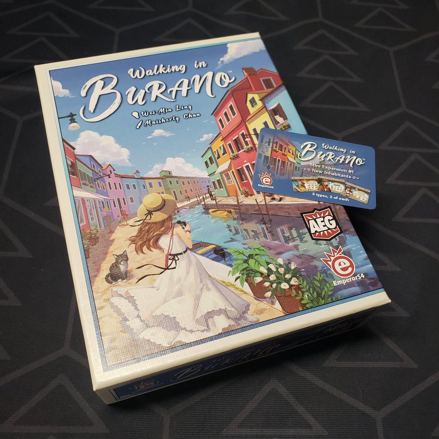 Image shows the front cover of the box for the Walking in Burano card game