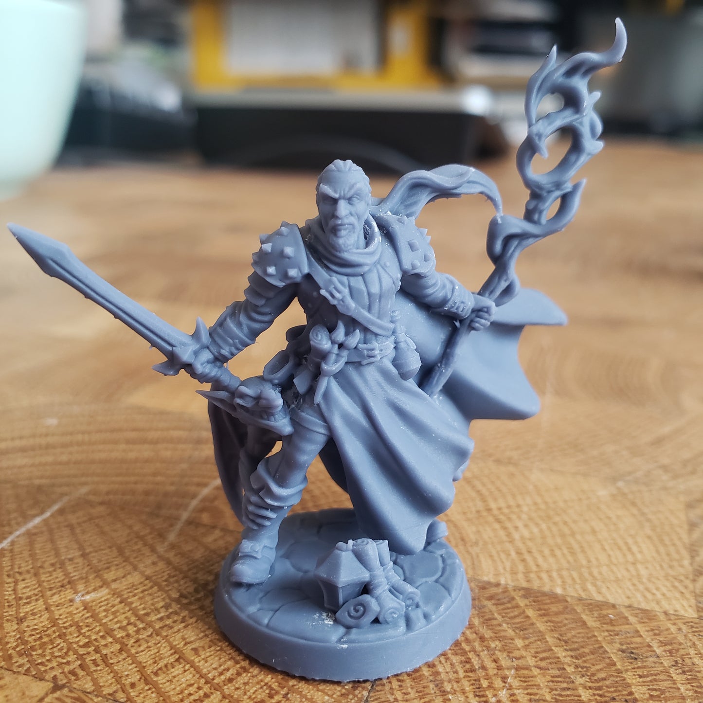 Image is a photo of a 3D printed wizard gaming miniature printed in-house at All Systems Go