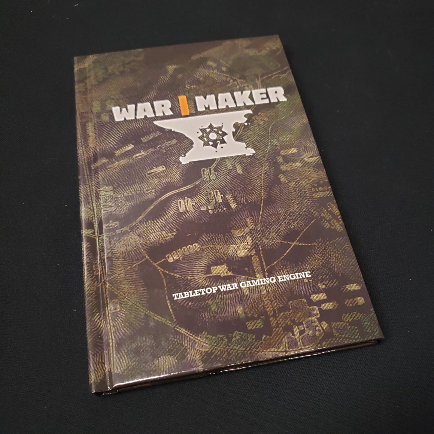Image shows the front cover of the WAR MAKER gaming book
