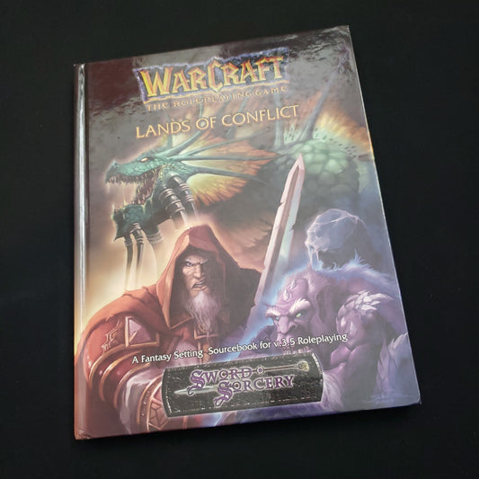 Image shows the front cover of the Lands of Conflict book for the roleplaying game Warcraft