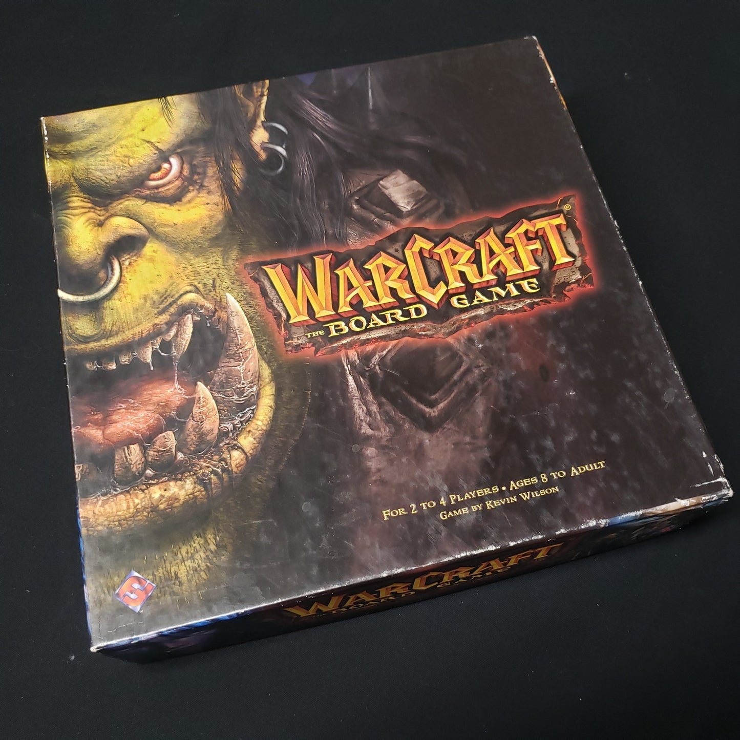 Image shows the front cover of the box of Warcraft: The Board Game