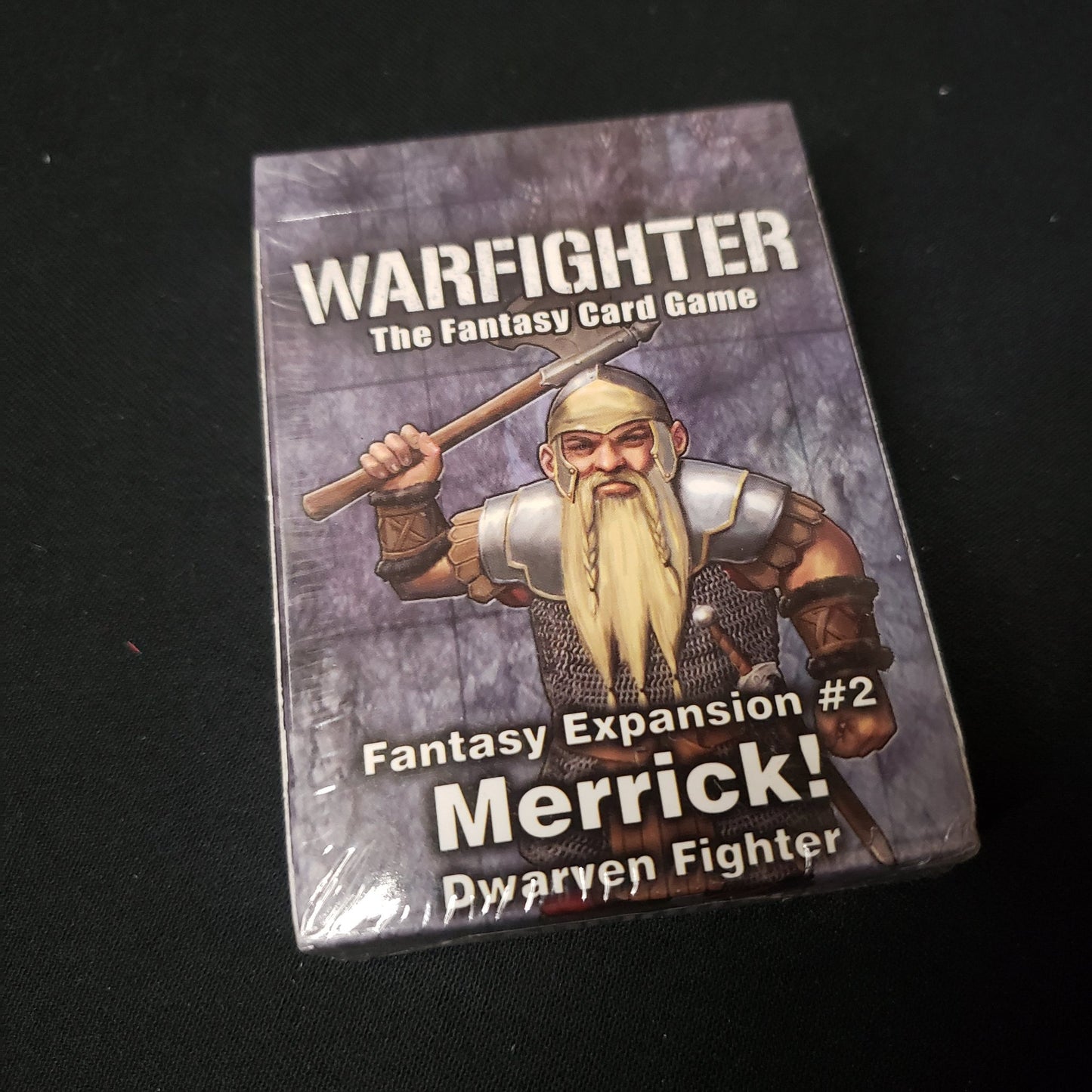 Image shows the front of the package for the Merrick Expansion Pack for the Warfighter: Fantasy card game